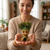 Woman holding an interactive green moss figure in her hands